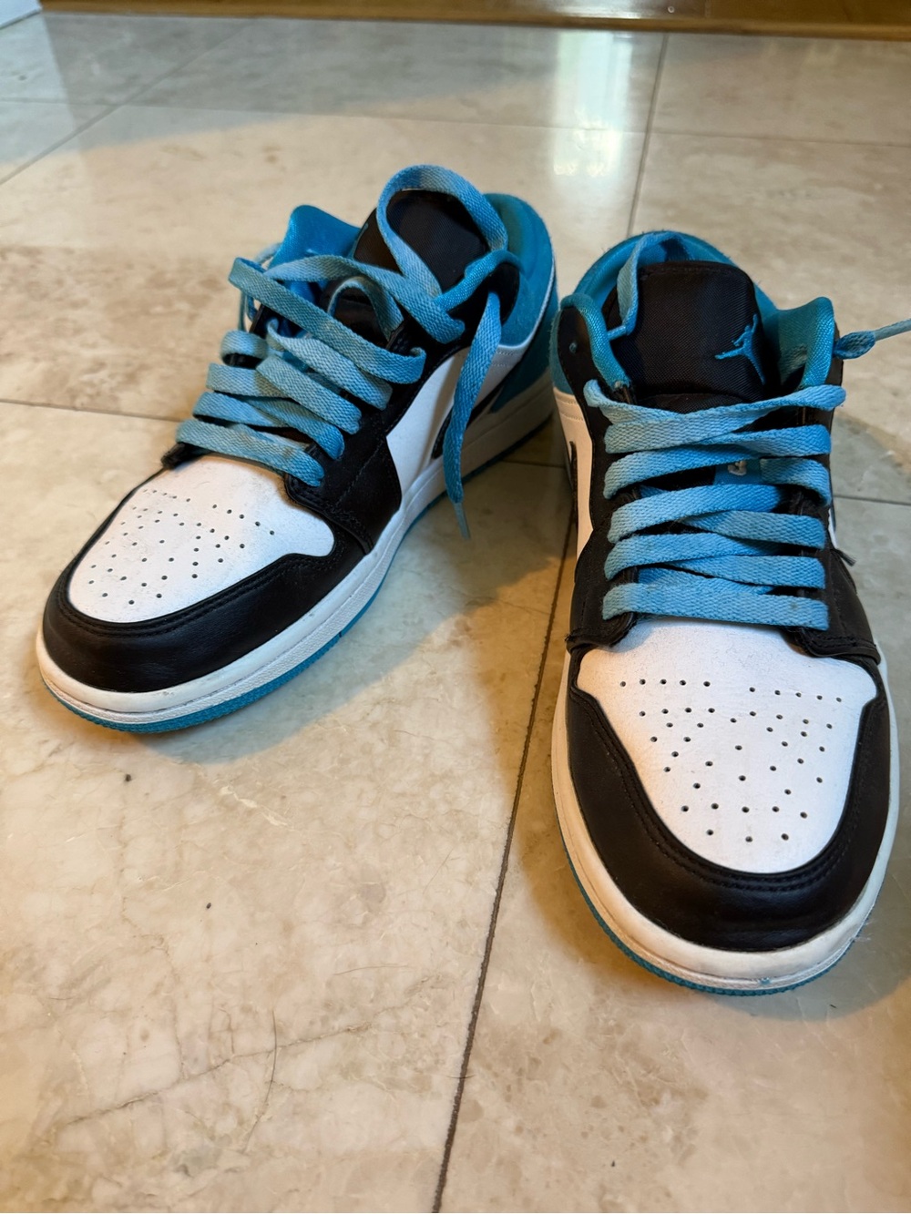 Black and White Low-Top Sneakers with Bright Blue Accents- Jordan Low 1 Blazers